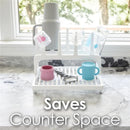 Gray drying rack displaying various cups and utensils, promoting counter space savings.