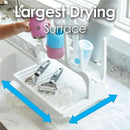 Gray drying rack with cups and utensils, featuring the largest drying surface, positioned on a countertop.