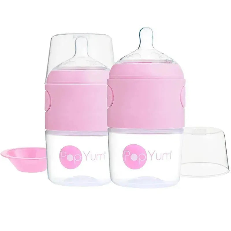 Two 5 oz Popyum baby bottles in pastel purple with anti-colic design, accompanied by a pink cap and a separate lid.