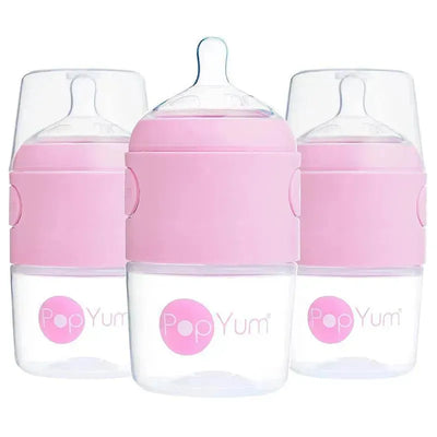 Three 5 oz. pastel purple anti-colic baby bottles by PopYum, featuring a clear base and pink silicone band.