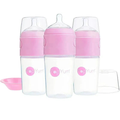 Three 9 oz pastel purple baby bottles from PopYum, designed to prevent colic, with caps and a pink silicone disk.