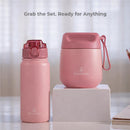 12 oz pink insulated straw water bottle by Primo Passi, next to a matching pink container, with a soft focus background.