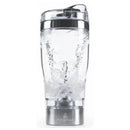 Portable Primo Passi formula mixer cup in stainless steel and acrylic, filled with water and showing mixing action.
