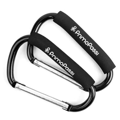 Two black Primo Passi large stroller hooks featuring foam grips, designed for hanging bags and accessories.
