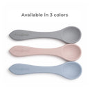 Primo Passi 2Pk Silicone Spoons in dusty blue, pink, and gray, designed for feeding infants, featuring smooth, rounded edges.