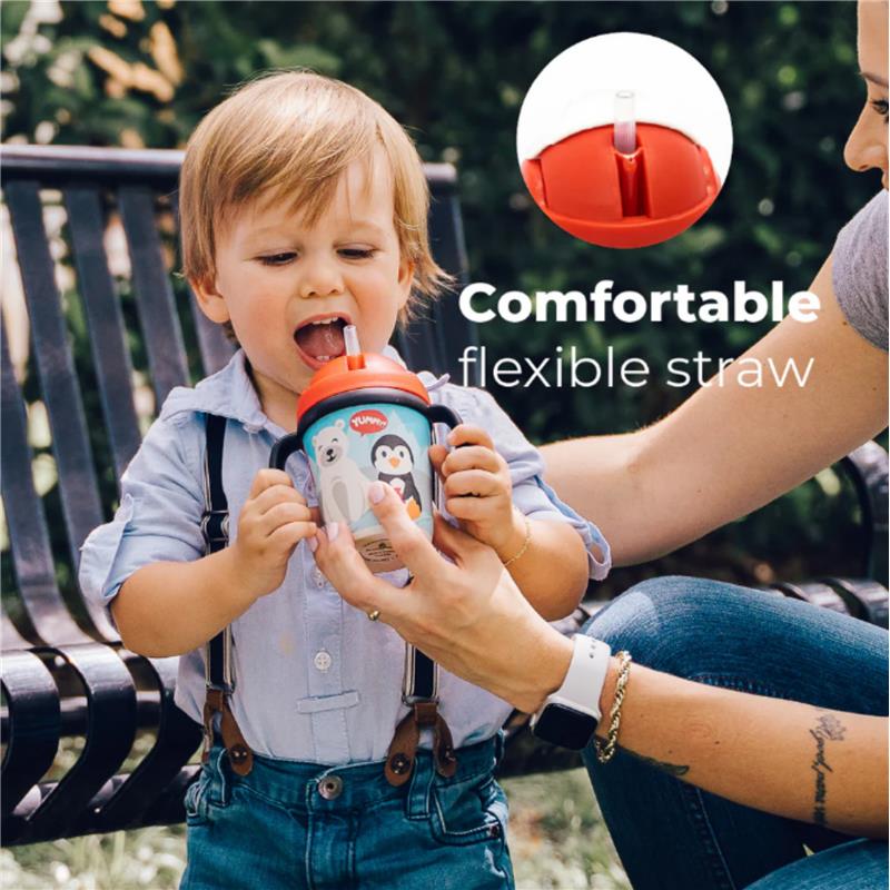 Bamboo fiber kids cup with handles and straw featuring a penguin and polar bear design, held by a child.
