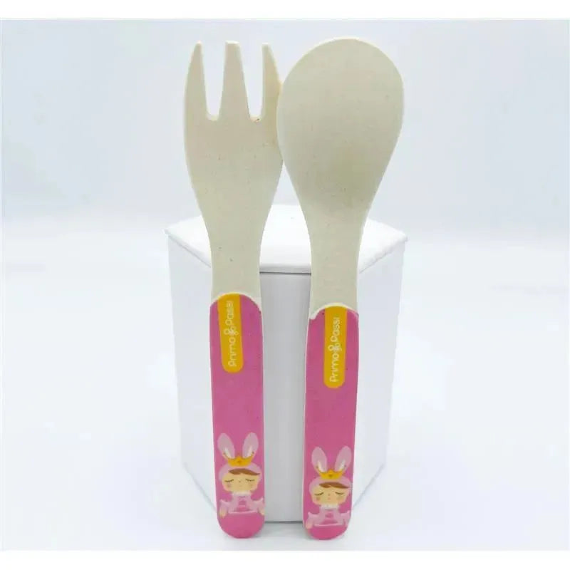 Bamboo fiber kids spoon and fork set by Primo Passi, featuring a pink handle with a rabbit illustration.