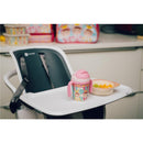 Bamboo fiber kids’ dinnerware set featuring a divided plate, bowl, cup with handles, and fruit salad on a high chair tray.