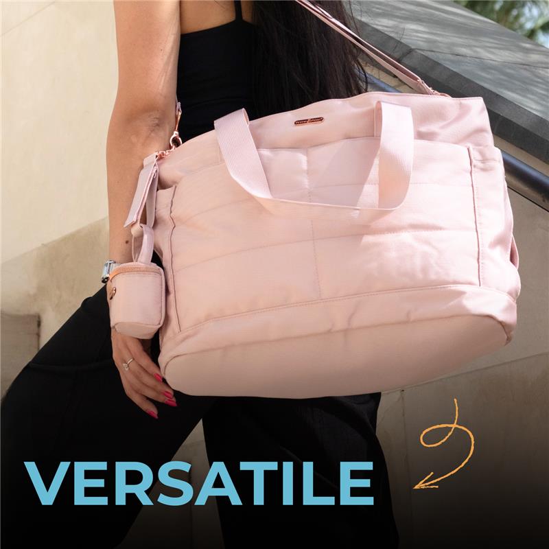 Black Primo Passi Diaper Bag being carried by a woman, showcasing its versatile design and functional features.