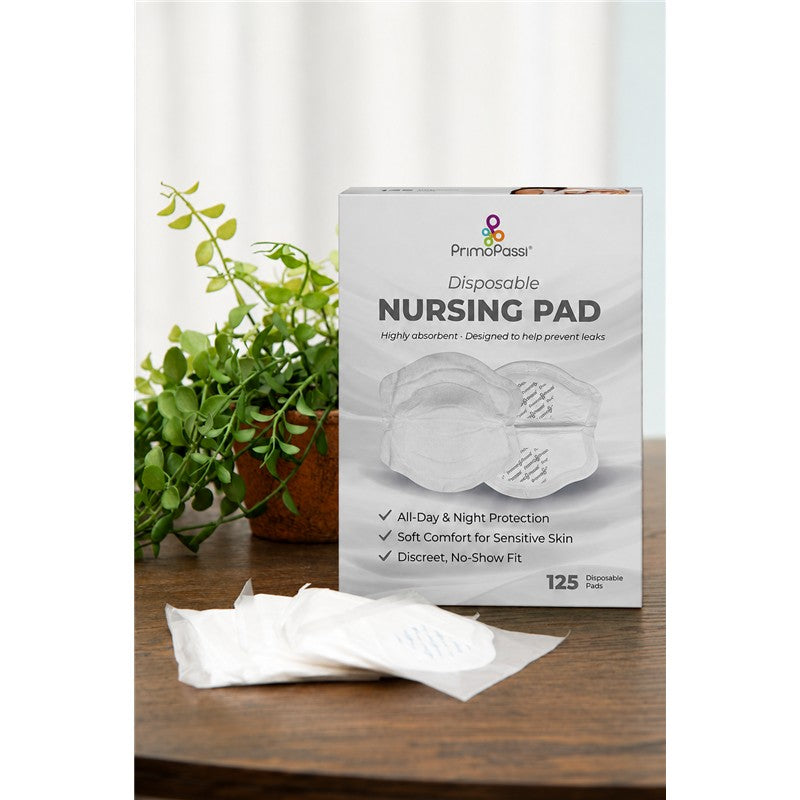 Primo Passi Disposable Nursing Breast Pads box with 125 count, featuring details on absorbency and comfort, alongside several visible pads.