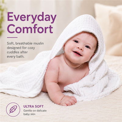 Hooded bath towel displayed on a baby, promoting soft, breathable muslin for cozy post-bath cuddles.