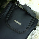 Insulated bottle bag by Primo Passi in pink with a zipper and carrying handle, surrounded by white flowers.