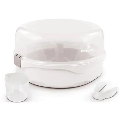 Microwave steam sterilizer by Primo Passi in white, includes a measuring cup and tongs, designed for sterilizing baby items.