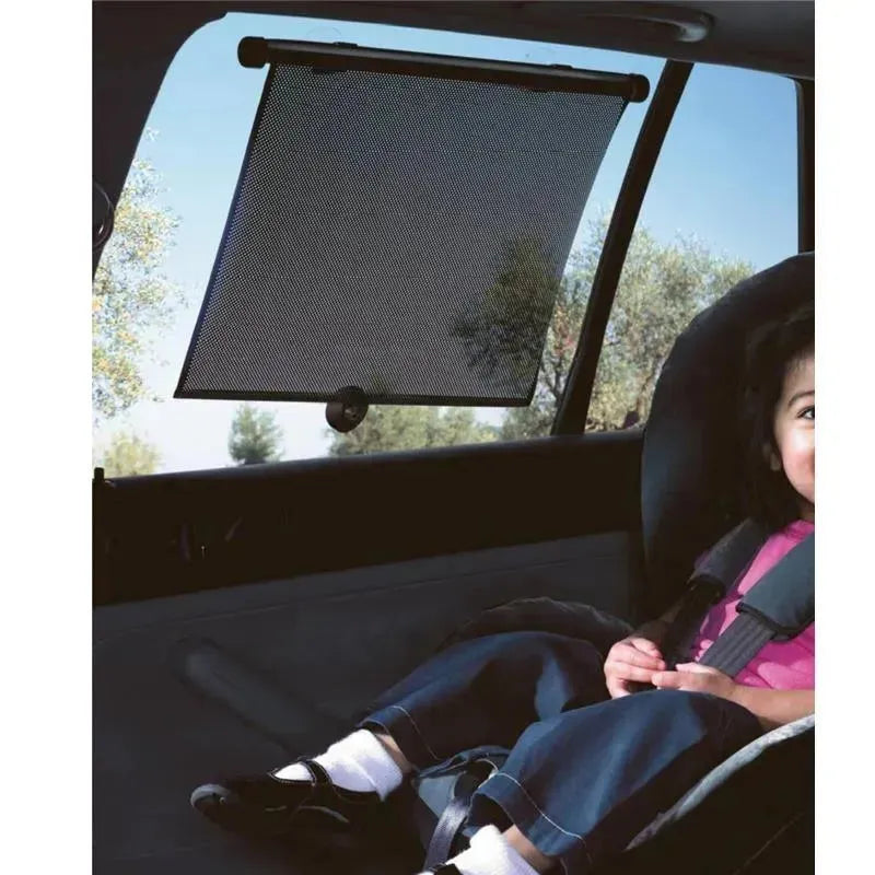 Roller sunshade installed in a car window, protecting a child in a safety seat from sunlight.