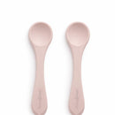 Rose pink silicone spoons from the Primo Passi set, designed for infant feeding and ease of use.
