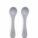 Silicone training spoons in senior grey, designed for young children; two pieces with comfortable handles.