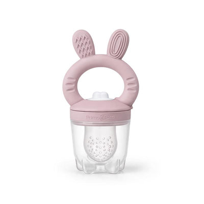 Silicone food feeder in rose pink, featuring a textured handle with bunny ears and a clear container for baby food.