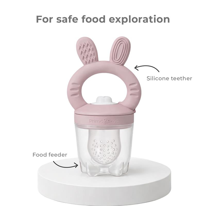Silicone food feeder with bunny ears design, combines a teether and feeding container for safe food exploration.