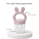 Silicone food feeder with bunny ears design, combines a teether and feeding container for safe food exploration.
