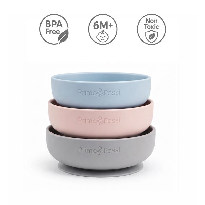 Silicone suction bowls in dusty blue, pink, and gray, labeled as BPA free, non-toxic, and suitable for 6 months+.