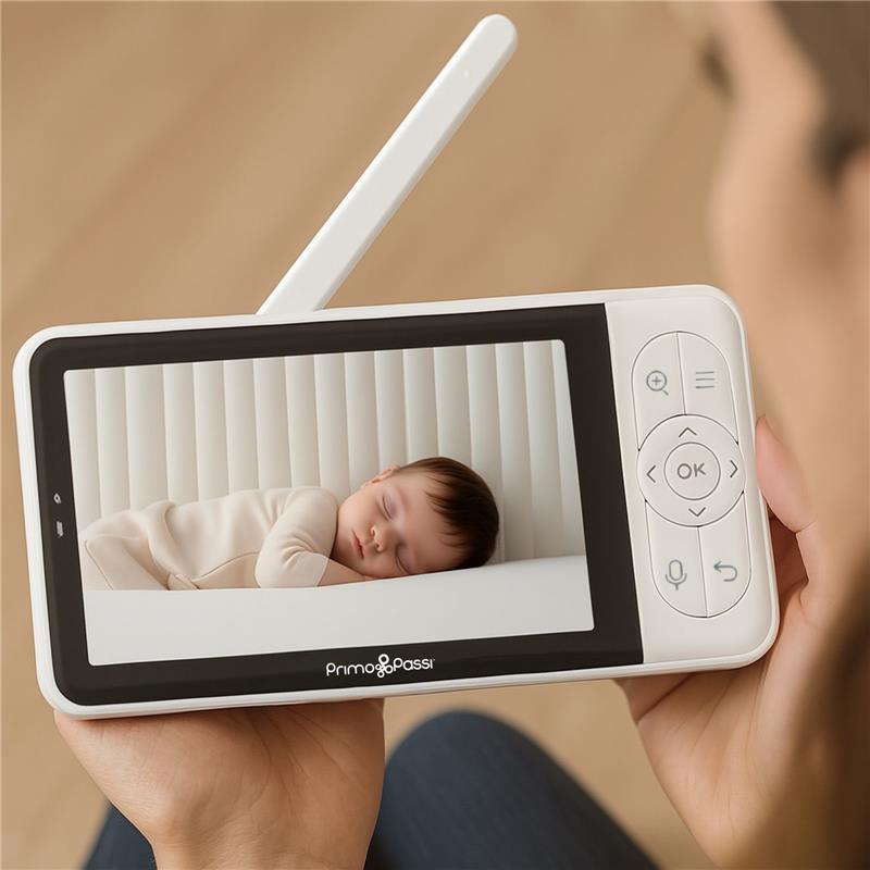 Smart Wi-Fi baby monitor displays a sleeping baby on a 5” HD screen, featuring controls and a white design.