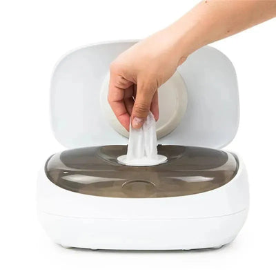 White Prince Lionheart EVO Wipes Warmer with a hand pulling out a warm wipe from the top opening.