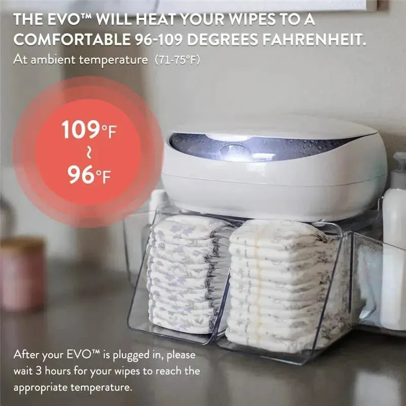 EVO Wipes Warmer in white, designed to heat wipes to 96-109°F, displayed next to neatly stacked wipes and a bottle.