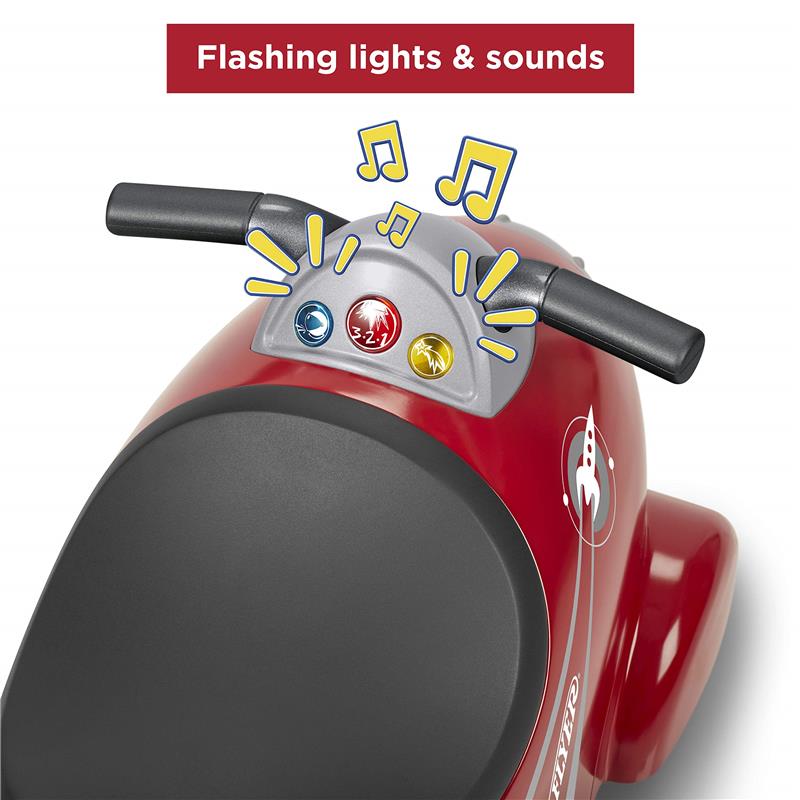 Retro Rocket Ride-On Toy by Radio Flyer featuring a red body, black seat, and control panel with flashing lights and sounds.