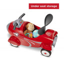Retro Rocket Ride-On Toy by Radio Flyer, featuring a red design with under-seat storage holding a monkey plush and toys.