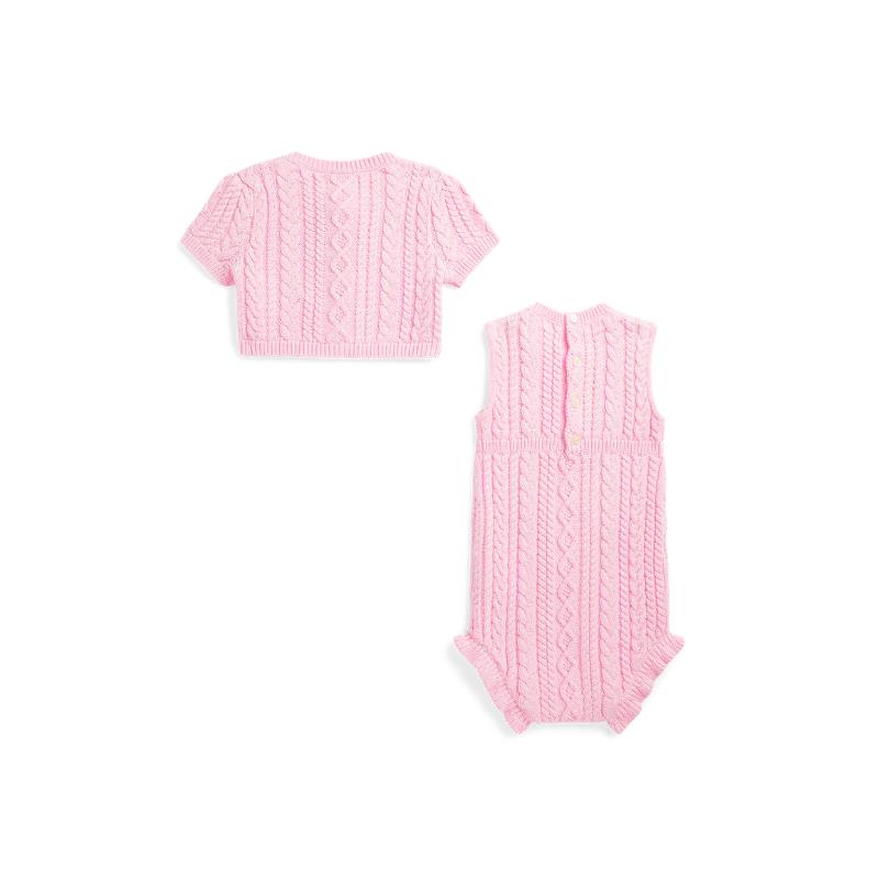Sleeveless pink cotton sweater shortall and matching cardigan with cable knit pattern.
