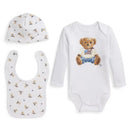 Three-piece set featuring a long-sleeve bear graphic bodysuit, matching hat with bear print, and a bib with tiny bear designs.