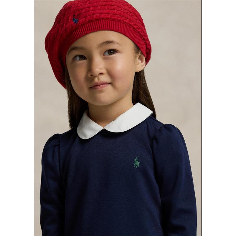 Girl wearing a navy Ralph Lauren collared shirt dress with puff sleeves and a red knit beret, featuring a green logo.
