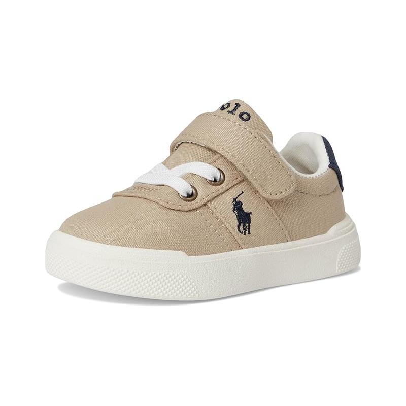 Unisex toddler casual sneakers in beige with white laces and a navy logo, featuring a Velcro strap for easy wear.