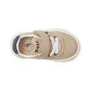 Tans and white toddler sneaker with Velcro strap, featuring the Polo Ralph Lauren logo inside.