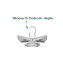 Silicone orthodontic nipple pacifier positioned upright, featuring a soft rounded shape and clear nipple design.