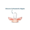 Light pink pacifier with a clear silicone orthodontic nipple, labeled for its orthodontic design.