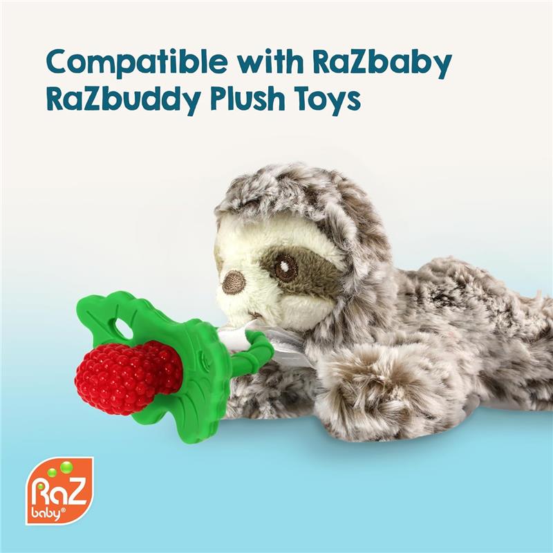 Red and green Razbaby Razberry Teether held by a sloth plush toy, designed for teething infants.