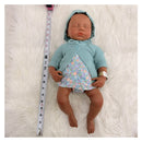 Reborn baby doll named Emily, featuring full silicone design, wearing a green cardigan and floral romper, with measuring tape beside.