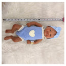 Bald African American reborn baby doll dressed in a blue knitted outfit with a heart, wearing a light blue headband.