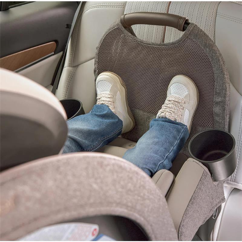 Romer Nexa All-in-One Convertible Car Seat in Truffle color, featuring a child seated with feet visible, in a car interior.