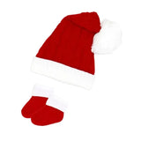 Red Santa hat with white trim and pom-pom paired with matching red booties, suitable for festive wear.