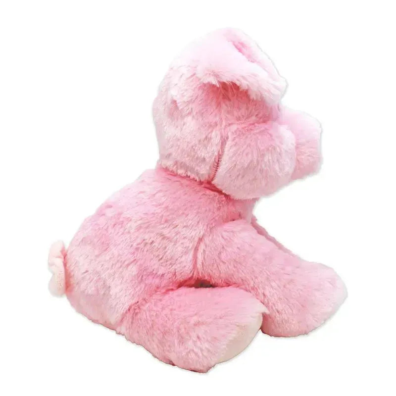 Stuffed pink pig toy with soft fur, featuring floppy ears and a small curly tail, sitting upright.