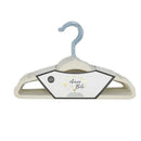 Cream velvet baby hangers in a pack of 15, featuring a silver hook and branding label.