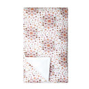 2-layer muslin blanket featuring a pink floral bouquet design with a soft white underside.