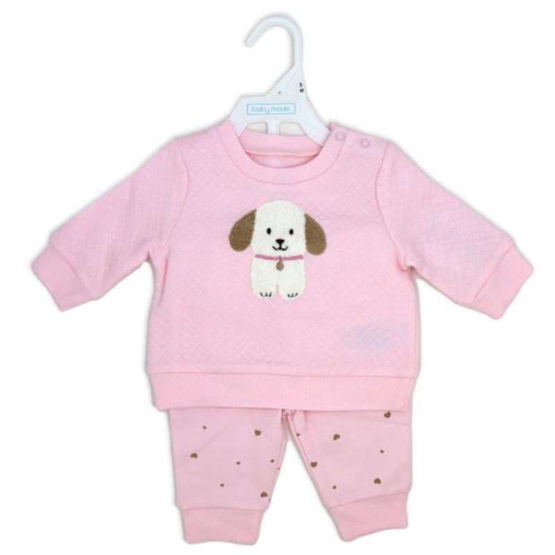 Quilted pink top featuring a dog design paired with pink fleece pants adorned with small hearts.