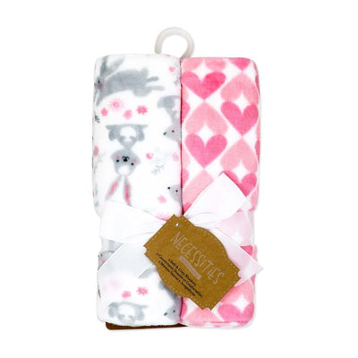 Flannel fleece blanket set featuring pink bunnies and a heart pattern, tied with a ribbon and tag.
