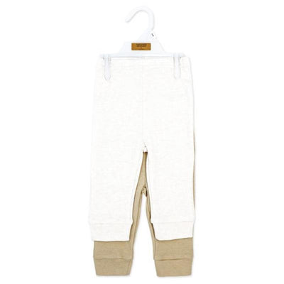 Beige cuffed pant set featuring two pairs in natural tones, hanging on a hook for display.