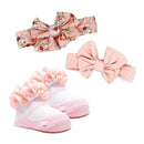 Three-piece baby headband and sock set featuring a floral printed headband, a solid pink headband, and pink frilly socks.