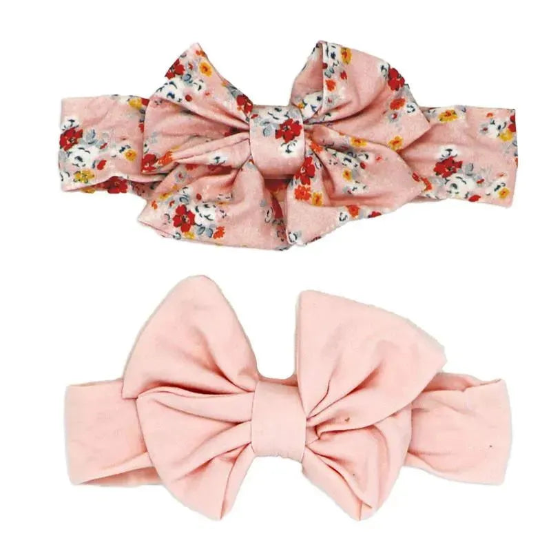 Three-piece set featuring two floral headbands and a pair of matching pink socks, perfect for infants.