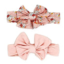 Three-piece set featuring two floral headbands and a pair of matching pink socks, perfect for infants.